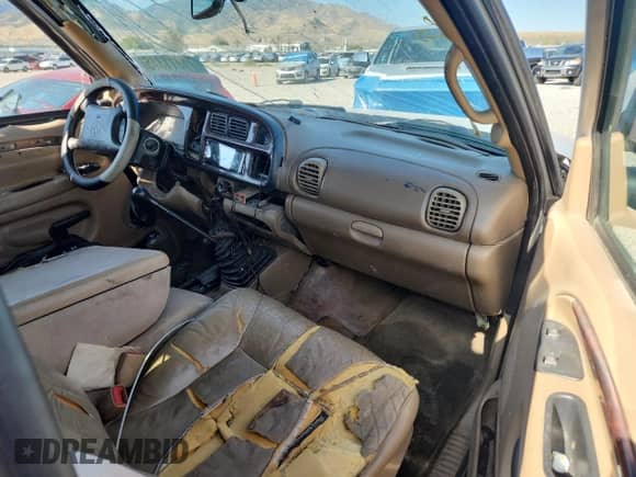 2000 Dodge 2500 with VIN 3B7KF2361YG115040, listed as a Copart auction lot 71311315 with Not provided miles and Salvage title. Bid and sale history available at DreamBid. Image 8.