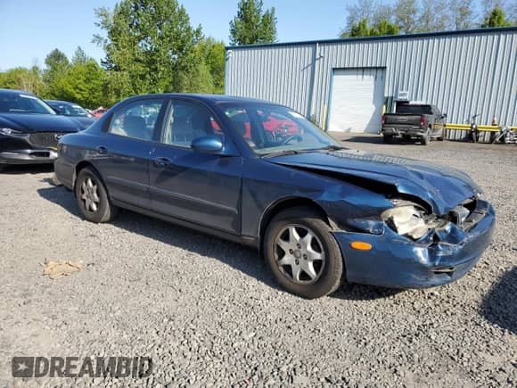 2001 Hyundai Sonata GLS z VIN KMHWF35V41A419720, wystawiony jako Copart lot #55110855 z przebiegiem 147 159 mil mil oraz Szkoda całkowita • Salvage title. Historia ofert i sprzedaży dostępna na DreamBid. Obrazek 4.