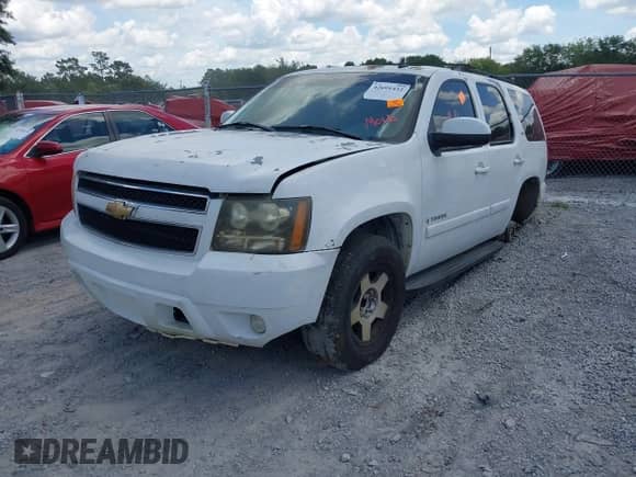 2007 Chevrolet Tahoe LTZ with VIN 1GNFC13J07J153453, listed as a IAAI auction lot 42691432 with Not provided miles and . Bid and sale history available at DreamBid. Image 2.
