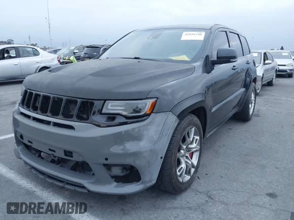 2014 Jeep Grand Cherokee SRT-8 z VIN 1C4RJFDJ9EC347505, wystawiony jako IAAI lot #41896248 z przebiegiem 59 049 mil mil oraz . Historia ofert i sprzedaży dostępna na DreamBid. Obrazek 6.