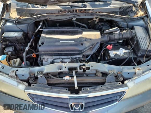 2002 Honda Odyssey LX with VIN 2HKRL18532H504584, listed as a Copart auction lot 67735975 with 230,708 mi miles and Salvage title. Bid and sale history available at DreamBid. Image 12.