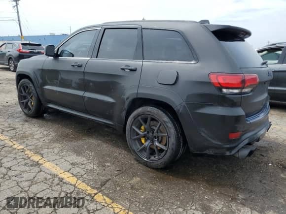 2018 Jeep Grand Cherokee Trackhawk z VIN 1C4RJFN92JC318555, wystawiony jako Copart lot #60436545 z przebiegiem 58 628 mil mil oraz Czysty tytuł • Clean title. Historia ofert i sprzedaży dostępna na DreamBid. Obrazek 2.