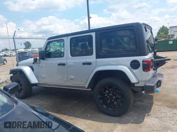 2023 Jeep Wrangler Sahara with VIN 1C4JJXP69PW695915, listed as a IAAI auction lot 42662028 with 36,957 mi miles and . Bid and sale history available at DreamBid. Image 14.