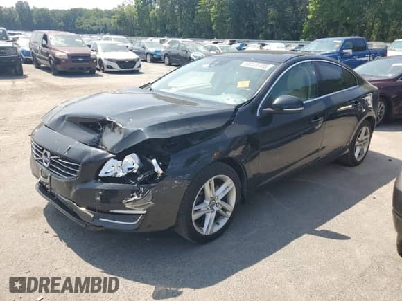 2015 Volvo S60 T5 Drive-E Premier with VIN YV140MFK6F2336518, listed as a Copart auction lot 68339405 with 142,401 mi miles and Salvage title. Bid and sale history available at DreamBid. Image 1.