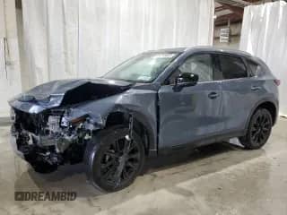 2023 Mazda CX-5 S Carbon Edition z VIN JM3KFBCM0P0292011, wystawiony jako Copart lot #71715585 z przebiegiem 30 893 mil mil oraz Szkoda całkowita • Salvage title. Historia ofert i sprzedaży dostępna na DreamBid. Obrazek 1.
