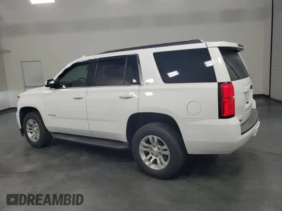 2019 Chevrolet Tahoe LT с VIN 1GNSKBKC5KR285001, выставлен на аукционе Copart как лот 68618185 с пробегом 150 743 миль миль и Списание • Salvage title. История ставок и продаж доступна на DreamBid. Изображение 2.