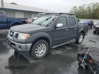 2010 Nissan Frontier LE with VIN 1N6AD0EV0AC419279, listed as a Copart auction lot 82463385 with 83,722 mi miles and Salvage title. Bid and sale history available at DreamBid. Image 1.