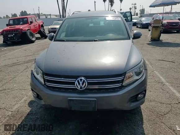 2013 Volkswagen Tiguan SE z VIN WVGAV3AXXDW606925, wystawiony jako Copart lot #64238585 z przebiegiem 131 779 mil mil oraz Szkoda całkowita • Salvage title. Historia ofert i sprzedaży dostępna na DreamBid. Obrazek 14.