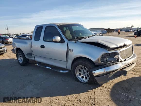 1999 Ford F-150 XL with VIN 2FTRX07W1XCA03134, listed as a Copart auction lot 41880835 with Not provided miles and Salvage title. Bid and sale history available at DreamBid. Image 4.