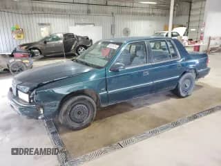 1994 Dodge Spirit with VIN 3B3AA4638RT310022, listed as a Copart auction lot 63479515 with 157,435 mi miles and Salvage title. Bid and sale history available at DreamBid. Image 1.
