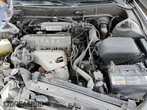 1994 Toyota Camry LE z VIN JT2SK12E0R0215689, wystawiony jako Copart lot #68546935 z przebiegiem 334 264 mil mil oraz Nie do naprawy • Non repairable. Historia ofert i sprzedaży dostępna na DreamBid. Obrazek 12.