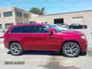 2012 Jeep Grand Cherokee SRT-8 z VIN 1C4RJFDJ9CC120960, wystawiony jako IAAI lot #42713331 z przebiegiem 136 836 mil mil oraz . Historia ofert i sprzedaży dostępna na DreamBid. Obrazek 13.