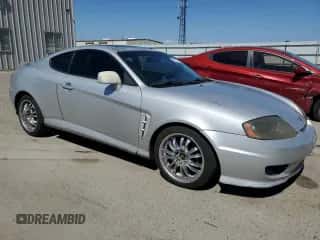 2006 Hyundai Tiburon GT с VIN KMHHN65F26U225506, выставлен на аукционе Copart как лот 56997285 с пробегом 170 175 миль миль и Списание • Salvage title. История ставок и продаж доступна на DreamBid. Изображение 4.