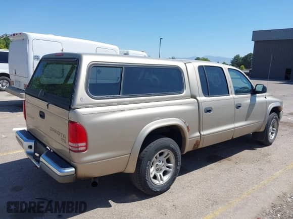 2004 Dodge Dakota SLT with VIN 1D7HL48N04S653798, listed as a IAAI auction lot 42520546 with 115,259 mi miles and . Bid and sale history available at DreamBid. Image 4.