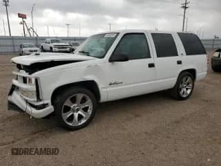 1999 Chevrolet Tahoe with VIN 1GNEC13R6XJ318682, listed as a Copart auction lot 54332255 with 79,584 mi miles and Salvage title. Bid and sale history available at DreamBid. Image 1.