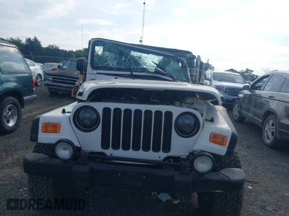 2004 Jeep Wrangler Sport z VIN 1J4FA49S34P802200, wystawiony jako IAAI lot #42706823 z przebiegiem Nie podano mil oraz . Historia ofert i sprzedaży dostępna na DreamBid. Obrazek 11.