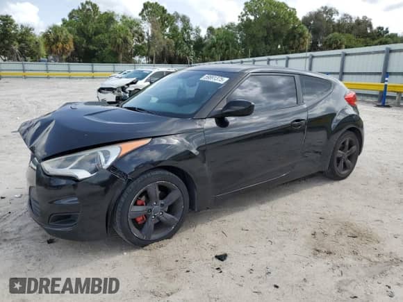 2014 Hyundai Veloster z VIN KMHTC6AD3EU196343, wystawiony jako Copart lot #59891375 z przebiegiem 127 594 mil mil oraz Szkoda całkowita • Salvage title. Historia ofert i sprzedaży dostępna na DreamBid. Obrazek 1.