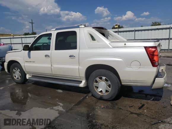 2002 Cadillac Escalade EXT with VIN 3GYEK63N62G352535, listed as a Copart auction lot 65949854 with 174,828 mi miles and Salvage title. Bid and sale history available at DreamBid. Image 2.
