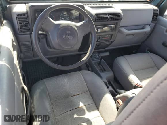 1998 Jeep Wrangler Sport z VIN 1J4FY19S5WP798597, wystawiony jako Copart lot #68707305 z przebiegiem Nie podano mil oraz Szkoda całkowita • Salvage title. Historia ofert i sprzedaży dostępna na DreamBid. Obrazek 8.