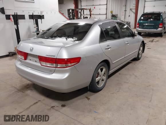 2003 Honda Accord EX z VIN JHMCM55623C053506, wystawiony jako IAAI lot #41572271 z przebiegiem 199 802 mil mil oraz . Historia ofert i sprzedaży dostępna na DreamBid. Obrazek 4.