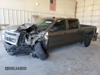 2015 Chevrolet Silverado 1500 LT with VIN 3GCUKREC9FG512928, listed as a Copart auction lot 86826105 with 123,962 mi miles and Salvage title. Bid and sale history available at DreamBid. Image 1.