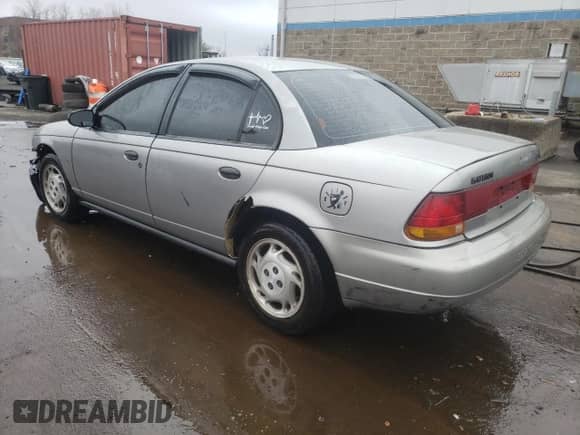 1996 Saturn SL с VIN 1G8ZK5272TZ265571, выставлен на аукционе Copart как лот 51267475 с пробегом 142 824 миль миль и Списание • Salvage title. История ставок и продаж доступна на DreamBid. Изображение 2.