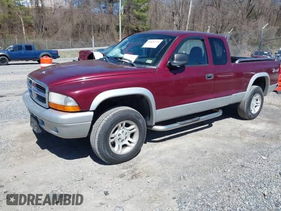 2003 Dodge Dakota SLT z VIN 1D7HG42N33S369870, wystawiony jako IAAI lot #41826771 z przebiegiem 214 840 mil mil oraz . Historia ofert i sprzedaży dostępna na DreamBid. Obrazek 2.