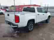 2021 Chevrolet Colorado 4WD Z71 z VIN 1GCGTDEN9M1256767, wystawiony jako IAAI lot #42188311 z przebiegiem 55 116 mil mil oraz . Historia ofert i sprzedaży dostępna na DreamBid. Obrazek 4.