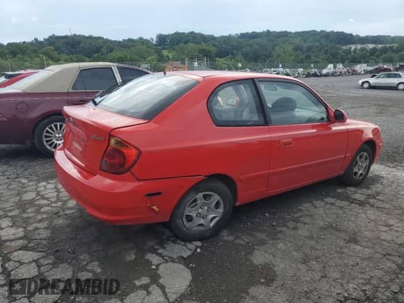 2003 Hyundai Accent GL с VIN KMHCG35C03U266754, выставлен на аукционе Copart как лот 63687705 с пробегом 99 309 миль миль и Списание • Salvage title. История ставок и продаж доступна на DreamBid. Изображение 3.