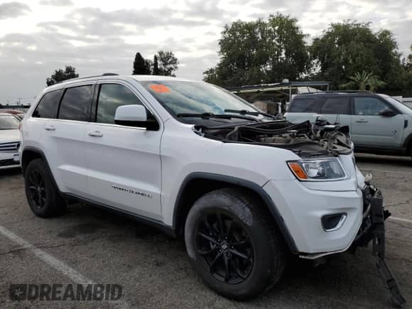 2014 Jeep Grand Cherokee Laredo with VIN 1C4RJEAG4EC265653, listed as a Copart auction lot 84594325 with Not provided miles and Salvage title. Bid and sale history available at DreamBid. Image 4.