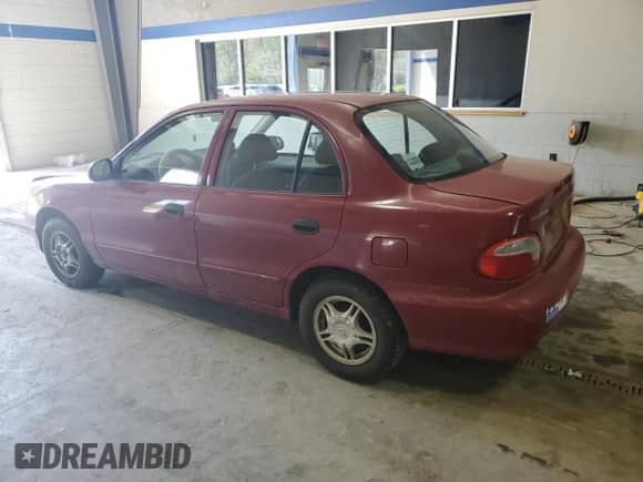 1999 Hyundai Accent GL z VIN KMHVF24N5XU575750, wystawiony jako Copart lot #52190805 z przebiegiem 205 655 mil mil oraz Czysty tytuł • Clean title. Historia ofert i sprzedaży dostępna na DreamBid. Obrazek 2.