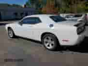 2023 Dodge Challenger SXT with VIN 2C3CDZAG0PH514863, listed as a Copart auction lot 87452795 with 51,682 mi miles and Salvage title. Bid and sale history available at DreamBid. Image 2.