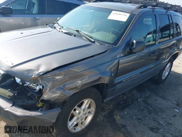 2003 Jeep Grand Cherokee Laredo z VIN 1J4GX48S63C578270, wystawiony jako IAAI lot #42656724 z przebiegiem 216 000 mil mil oraz . Historia ofert i sprzedaży dostępna na DreamBid. Obrazek 17.
