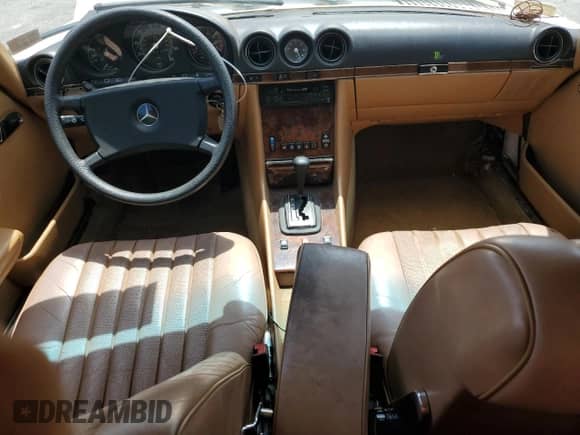 1984 Mercedes-Benz 380 SL with VIN WDBBA45A2EA011340, listed as a Copart auction lot 56949325 with 113,951 mi miles and Salvage title. Bid and sale history available at DreamBid. Image 8.
