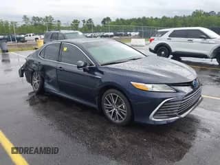 2021 Toyota Camry Hybrid XLE with VIN 4T1F31AK4MU546558, listed as a IAAI auction lot 42235763 with 62,299 mi miles and . Bid and sale history available at DreamBid. Image 1.