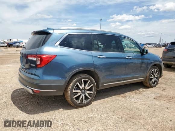 2020 Honda Pilot Touring 8-Passenger z VIN 5FNYF5H9XLB000448, wystawiony jako Copart lot #60402965 z przebiegiem 58 596 mil mil oraz Czysty tytuł • Clean title. Historia ofert i sprzedaży dostępna na DreamBid. Obrazek 3.