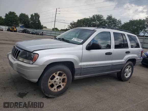 2002 Jeep Grand Cherokee Sport with VIN 1J4GW38S12C236897, listed as a Copart auction lot 61746635 with 141,693 mi miles and Clean title. Bid and sale history available at DreamBid. Image 1.