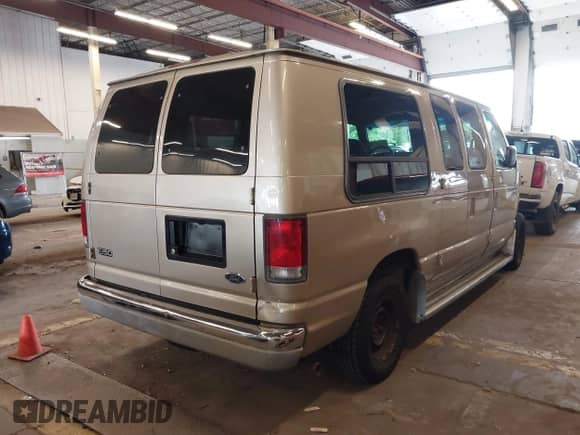 1999 Ford Econoline Cargo with VIN 1FDRE14W5XHA87026, listed as a IAAI auction lot 42573756 with 93,360 mi miles and . Bid and sale history available at DreamBid. Image 4.