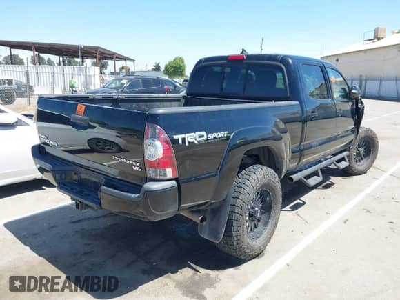 2014 Toyota Tacoma PreRunner with VIN 3TMKU4HN6EM041841, listed as a IAAI auction lot 42082629 with Not provided miles and . Bid and sale history available at DreamBid. Image 4.