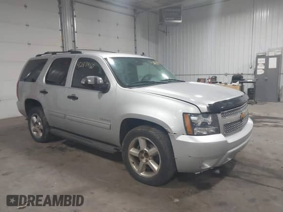 2012 Chevrolet Tahoe LT with VIN 1GNSCBE01CR326465, listed as a IAAI auction lot 42183450 with 220,129 mi miles and . Bid and sale history available at DreamBid. Image 6.