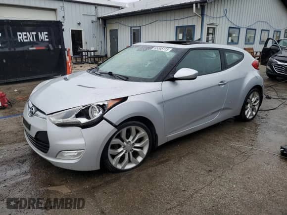 2012 Hyundai Veloster w/Red Int с VIN KMHTC6ADXCU022959, выставлен на аукционе Copart как лот 65585115 с пробегом Не указан миль и Списание • Salvage title. История ставок и продаж доступна на DreamBid. Изображение 1.