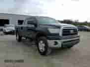 2013 Toyota Tundra z VIN 5TFUM5F1XDX046077, wystawiony jako Copart lot #65893365 z przebiegiem 240 153 mil mil oraz Szkoda całkowita • Salvage title. Historia ofert i sprzedaży dostępna na DreamBid. Obrazek 14.