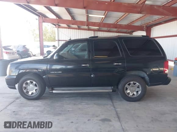 2003 Cadillac Escalade with VIN 1GYEK63N53R189958, listed as a IAAI auction lot 42940278 with 208,338 mi miles and . Bid and sale history available at DreamBid. Image 14.