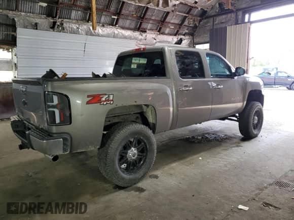 2013 Chevrolet Silverado 1500 LTZ z VIN 3GCPKTE77DG278332, wystawiony jako Copart lot #61771285 z przebiegiem 196 743 mil mil oraz Szkoda całkowita • Salvage title. Historia ofert i sprzedaży dostępna na DreamBid. Obrazek 3.