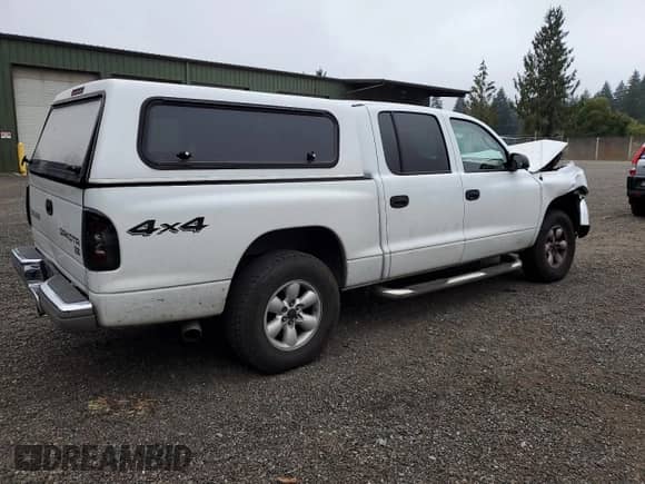2003 Dodge Dakota SLT z VIN 1D7HG48N83S276513, wystawiony jako Copart lot #80029045 z przebiegiem 211 278 mil mil oraz Szkoda całkowita • Salvage title. Historia ofert i sprzedaży dostępna na DreamBid. Obrazek 3.