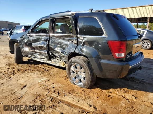 2009 Jeep Grand Cherokee with VIN 1J8HR68T19C550936, listed as a Copart auction lot 80090724 with 113,543 mi miles and Salvage title. Bid and sale history available at DreamBid. Image 2.