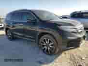 2020 Honda Pilot Touring 7-Passenger z VIN 5FNYF5H64LB006736, wystawiony jako Copart lot #87458574 z przebiegiem 63 534 mil mil oraz Szkoda całkowita • Salvage title. Historia ofert i sprzedaży dostępna na DreamBid. Obrazek 4.