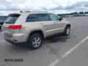 2014 Jeep Grand Cherokee Laredo z VIN 1C4RJFAG9EC264441, wystawiony jako IAAI lot #43020816 z przebiegiem 135 504 mil mil oraz . Historia ofert i sprzedaży dostępna na DreamBid. Obrazek 4.