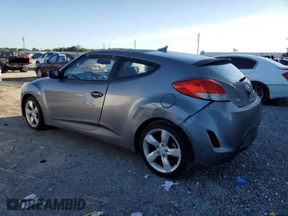 2012 Hyundai Veloster w/Black Int z VIN KMHTC6AD0CU023084, wystawiony jako Copart lot #82597005 z przebiegiem 187 990 mil mil oraz Czysty tytuł • Clean title. Historia ofert i sprzedaży dostępna na DreamBid. Obrazek 2.