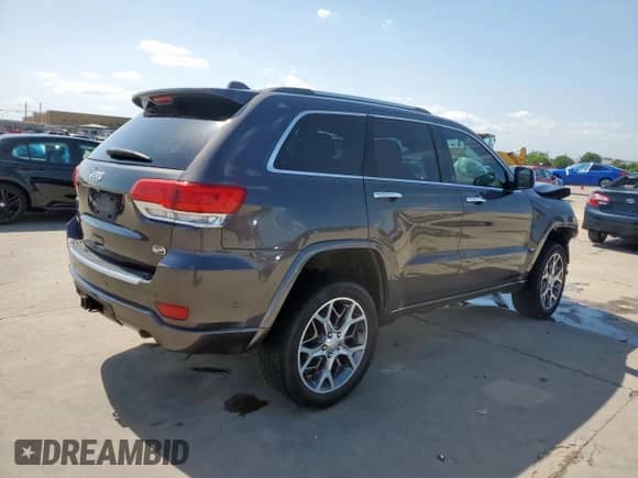 2020 Jeep Grand Cherokee Overland z VIN 1C4RJFCG8LC384810, wystawiony jako Copart lot #59996945 z przebiegiem 100 957 mil mil oraz Szkoda całkowita • Salvage title. Historia ofert i sprzedaży dostępna na DreamBid. Obrazek 3.